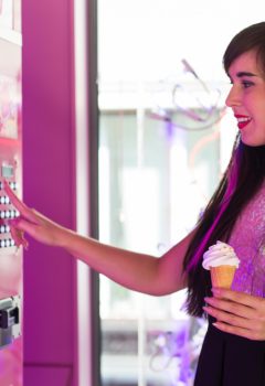 pretty-young-woman-using-modern-beverage-vending-machine-her-hand-is-placed-dial-pad.jpg